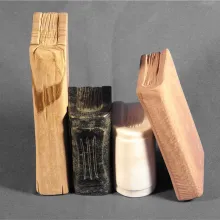 vier kleine Bücher aus verschiedenen Natursteinsorten.