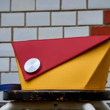 Olbrish Schultertasche Drehpunkt in Bauhaus-Farben