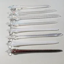Handcrafted glass pen made using traditional glassworking techniques.