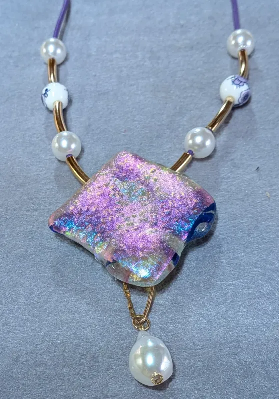 Necklace made with handcrafted dichroic glass pendant.