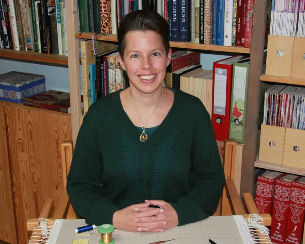 Acupictrix - Dr Jessica Grimm sitting behind her slate frame